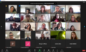 Screenshot of a zoom call. 25 individual rectangular screens with faces in them.    