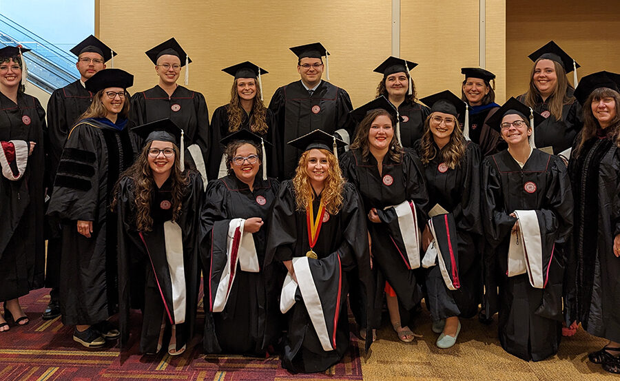 A group of people wearing academic regalia.