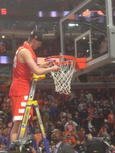 Syracuse's Tyler Lydon cuts down the net after the Orange pulled off an improbable comeback to down 1-seed Virginia on March 27 in Chicago and earn a trip to the Final Four.